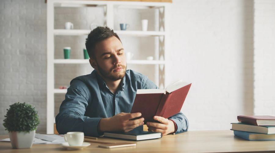 Man reading NA Step Guide and reviewing Step One Honesty