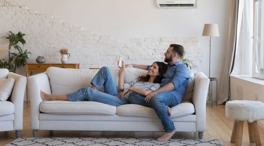 Couple in recovery laying next to each other on a sofa displaying romance in recovery