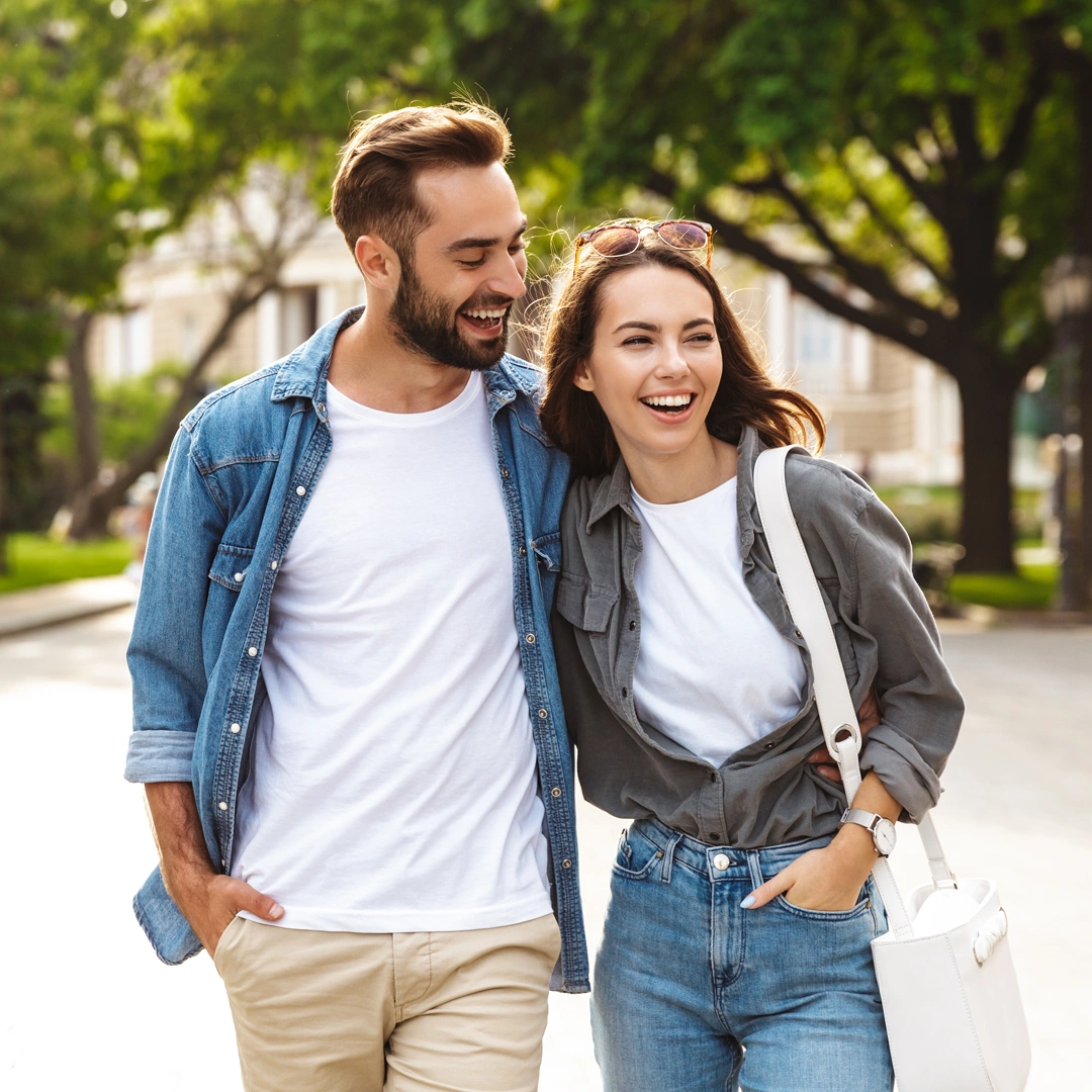 Blue-Cross-Blue-Shield--Mental-and-Behavioral-Health-Treatment-At-Changes-Healing-Center Smiling couple walking arm-in-arm on a sunny, tree-lined street—conveying connection, stability, and renewed well-being.