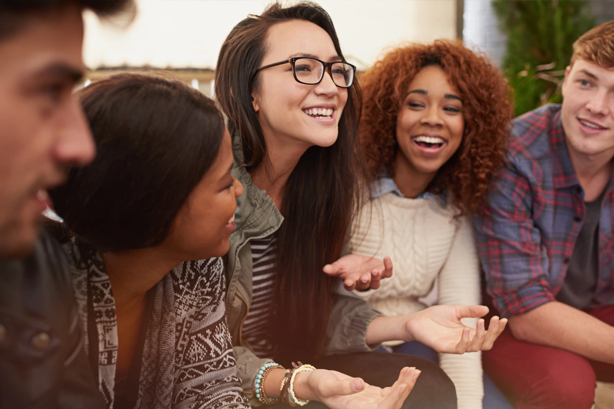 Young adults smiling and supporting one another in a recovery group at Changes Healing Center in Phoenix, Arizona.