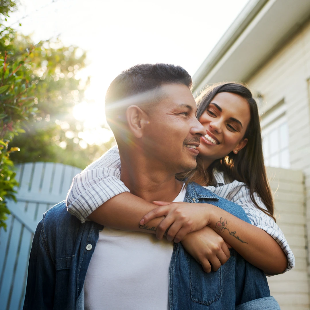 Smiling couple embracing outdoors with warm sunlight—symbolizing hope, family support, and AHCCCS-accepted addiction treatment at Changes Healing Center in Arizona.