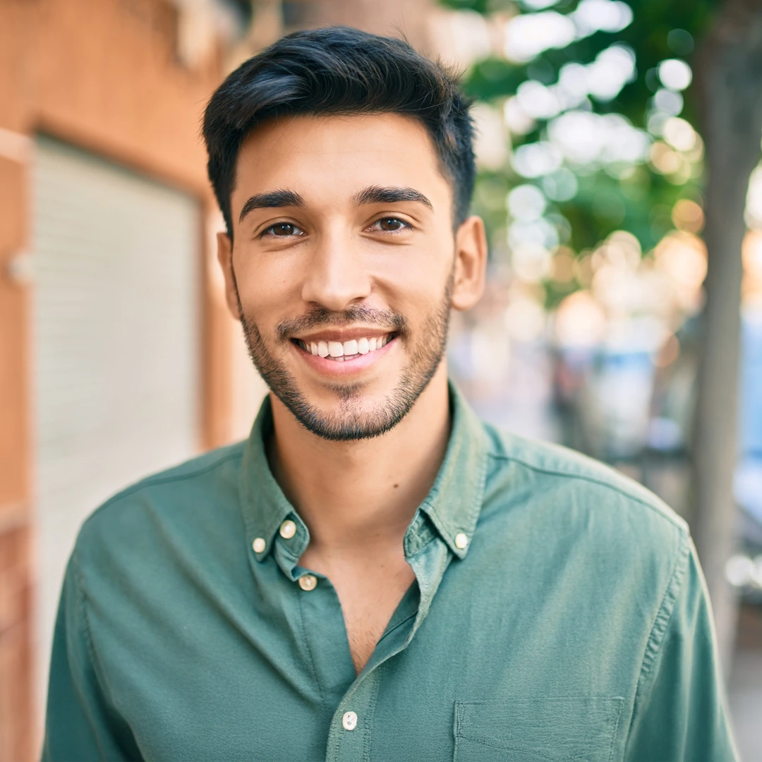 Smiling young adult outdoors, representing whole-person inpatient rehab in Arizona at Changes Healing Center.