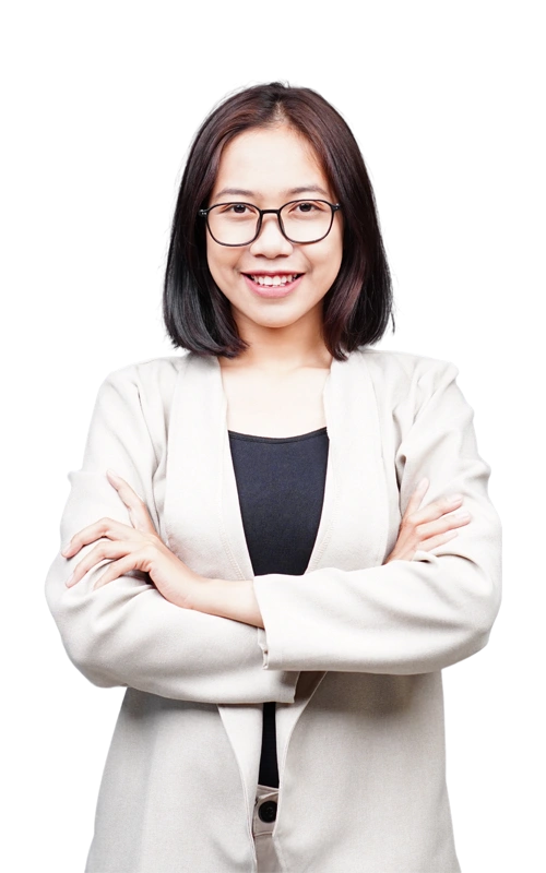 Depression-Treatment-At-Changes-Healing-Center Smiling young woman with glasses and a beige blazer standing confidently with her arms crossed.