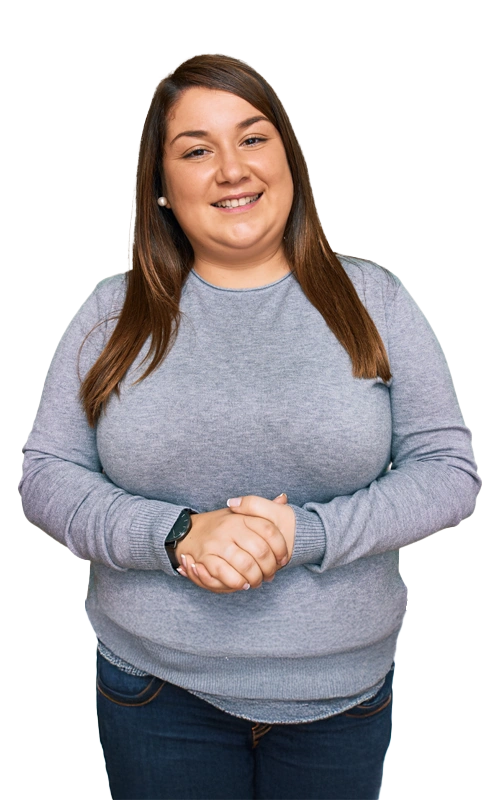 Meth-Addiction-Treatment-in-Arizona-At-Changes-Healing-Center Smiling young woman in a gray sweater standing with hands clasped, symbolizing hope and support during meth addiction recovery.